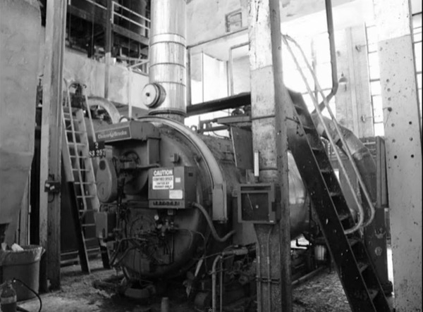 Historical image of an original Cleaver-Brooks boiler in the power house.