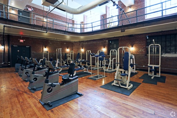 A modern photograph showing the restored original gymnasium within the former West Philadelphia High School now known as West Lofts.